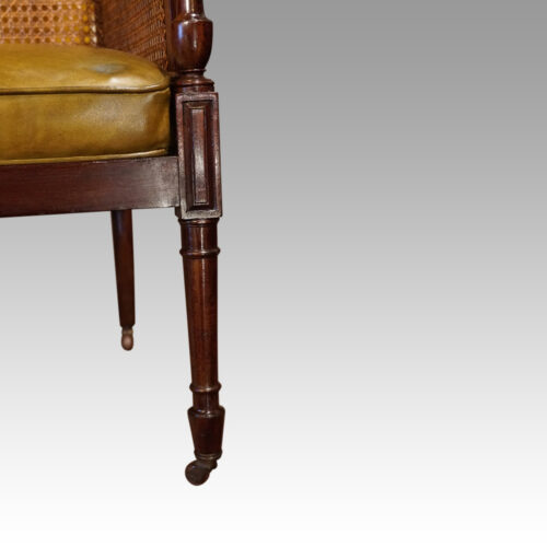 Regency mahogany bergere library chair front leg