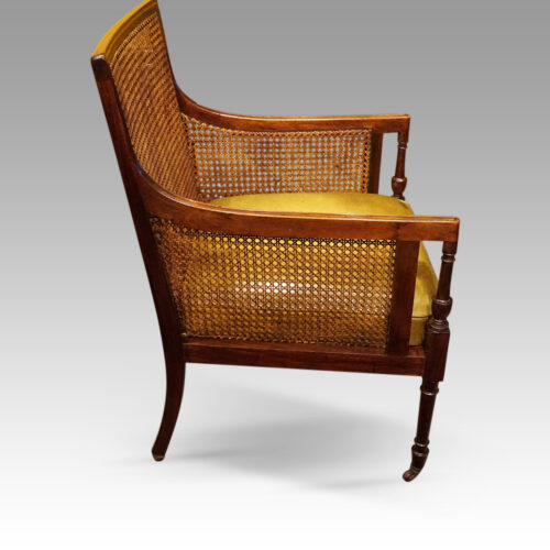 Regency mahogany bergere library chair side