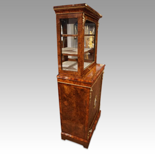 Victorian walnut and sevres pier cabinet at angle