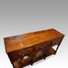 Antique oak pot board dresser shaped apron top angle