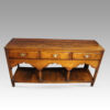 Antique South Wales oak dresser base drawers end top drawer front legs shaped arch front