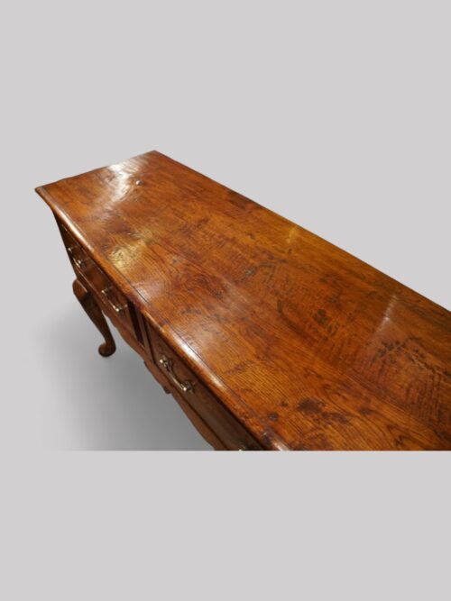 Antique oak cabriole leg dresser base top close up