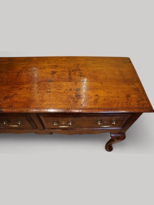 Antique oak cabriole leg dresser base top detail