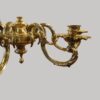 Cast brass 8 arm chandelier body detail