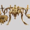 Cast brass 8 arm chandelier detail