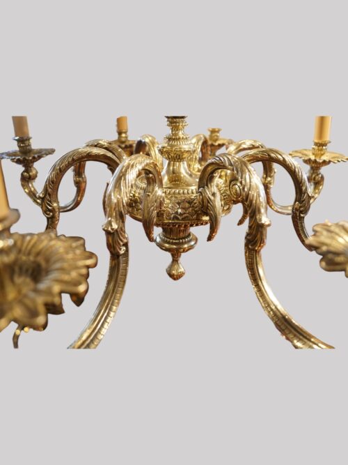 Cast brass 8 arm chandelier detail