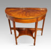 Pair of Edwardian demi-lune tables front