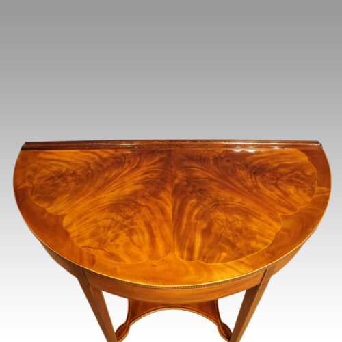 Pair of Edwardian demi-lune tables front top detail