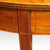 Pair of Edwardian demi-lune tables leg