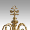 Pair of Dutch brass chandeliers surmount