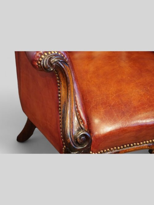 Victorian rosewood button leather library chair arm detail