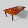 Regency mahogany extending dining table angle view