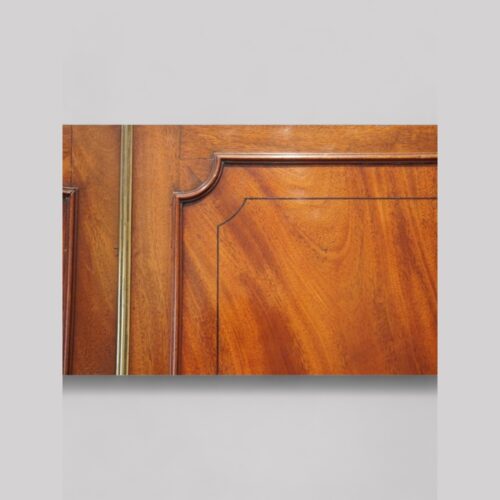 Regency mahogany linen press door detail