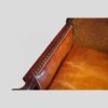 Pair of Edwardian leather club chairs arm rail