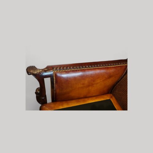 Pair of Edwardian leather club chairs inside arm panel