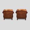 Pair of Edwardian leather club chairs rear