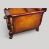 Pair of Edwardian leather club chairs side panel