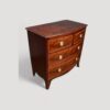 Small Georgian inlaid bow chest at angle