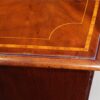 Small Georgian inlaid bow chest corner