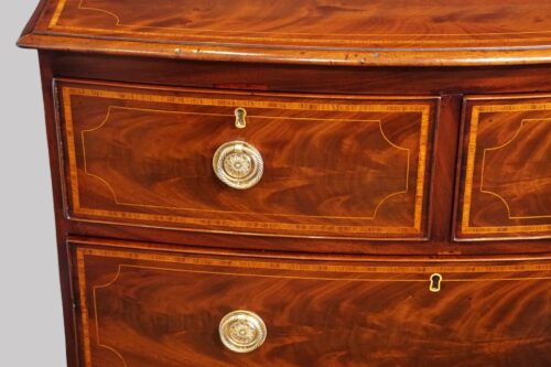 Small Georgian inlaid bow chest drawer front
