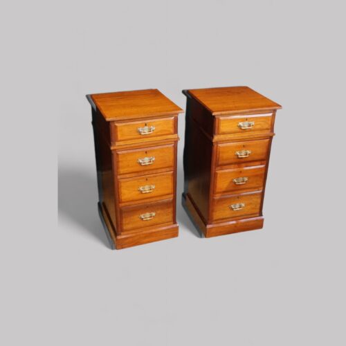Pair of Edwardian walnut bedside chests angle