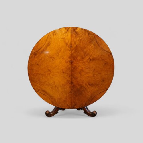 Victorian walnut circular dining table tilted