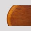 Oval mahogany cross banded dining table top detail banding