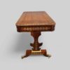 Regency brass inlaid library table end view