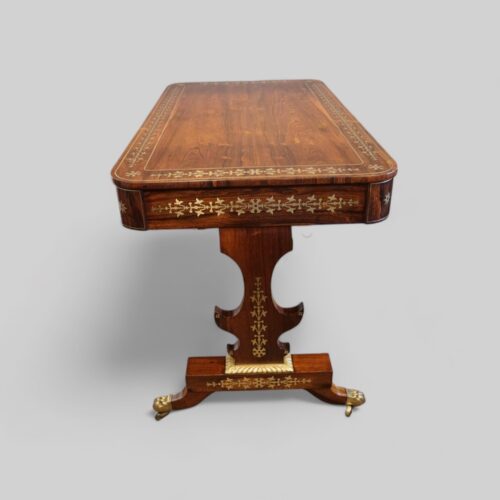 Regency brass inlaid library table end view