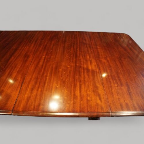 Antique mahogany extending dining table flecking in timber