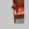 Tortoiseshell leather wing chair arm