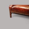 Tortoiseshell leather wing chair leg