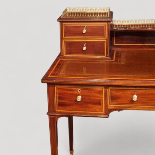 Edwardian inlaid mahogany writing table small drawers