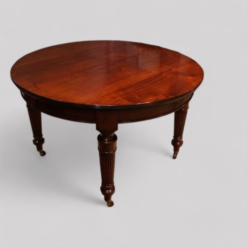 Edwardian mahogany circular extending dining table closed