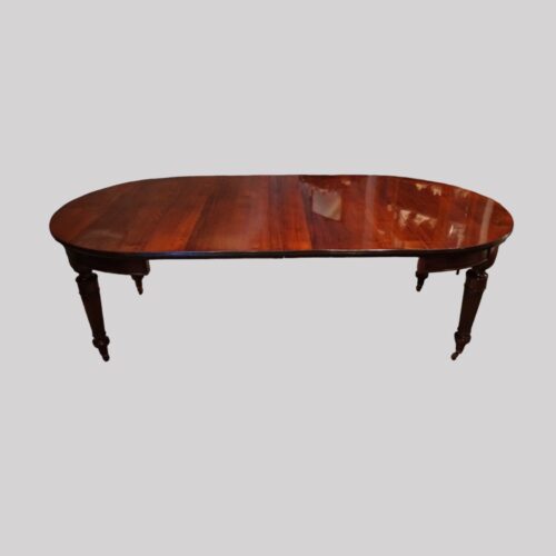 Edwardian mahogany circular extending dining table side
