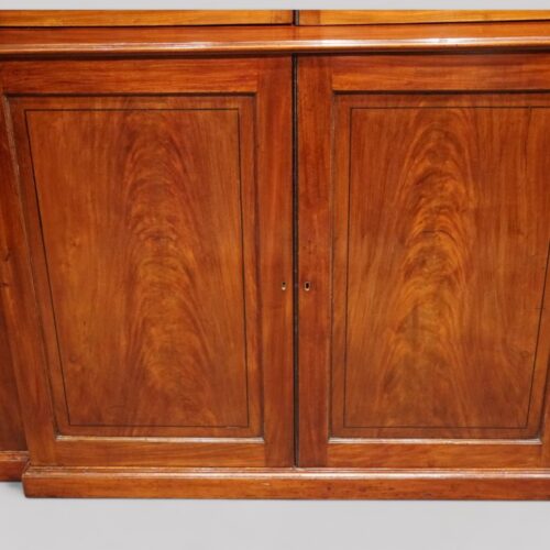 George III mahogany breakfront bookcase base centre doors