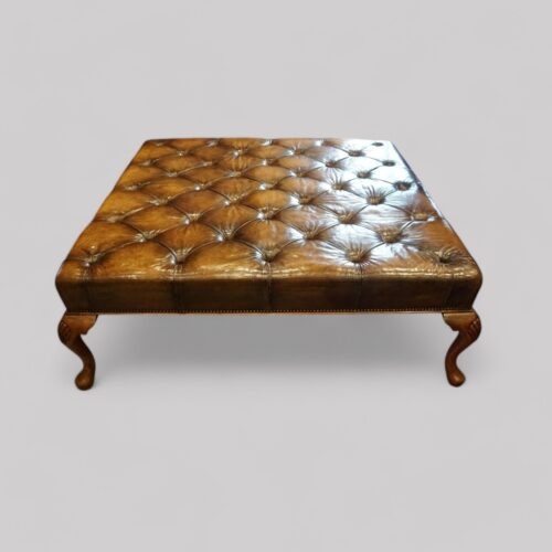 Large leather buttoned stool end view