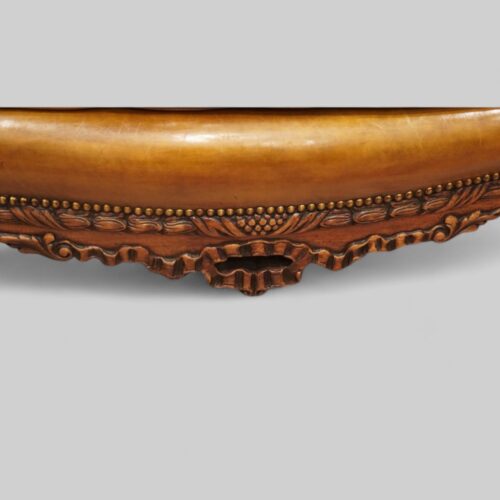 Pair of Edwardian leather sofas apron