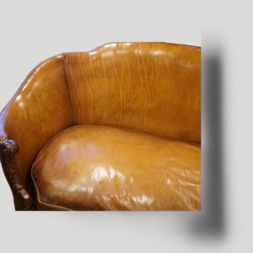 Pair of Edwardian leather sofas curved arm