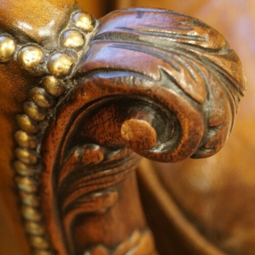 Pair of Edwardian leather sofas handgrip