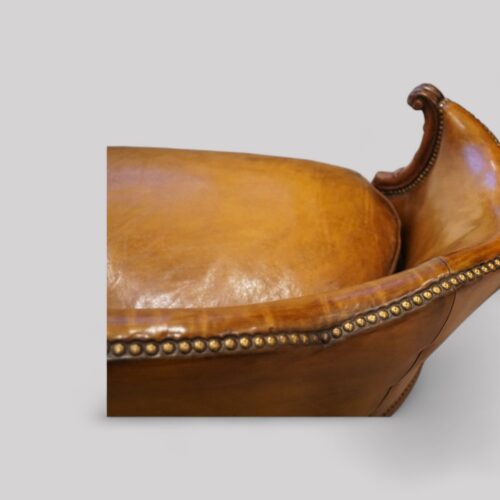 Pair of Edwardian leather sofas top rail