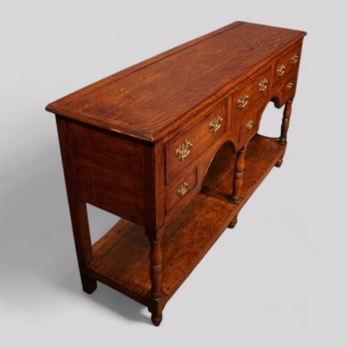 Antique oak pot board dresser base at angle