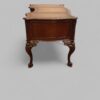 Chippendale style mahogany serpentine desk end view