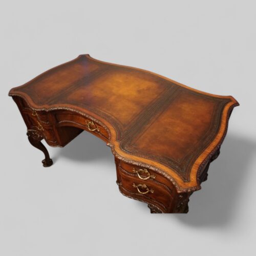Chippendale style mahogany serpentine desk leather