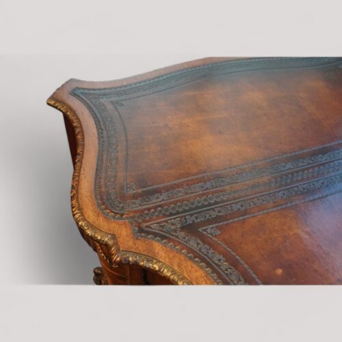 Chippendale style mahogany serpentine desk leather tooling