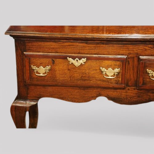 Antique oak cabriole leg dresser base drawer detail