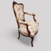 Pair of French walnut armchairs at angle