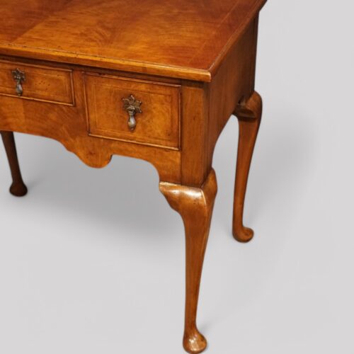 Queen Anne style walnut lowboy front leg