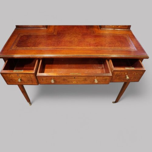 Edwardian inlaid satinwood writing table drawers open