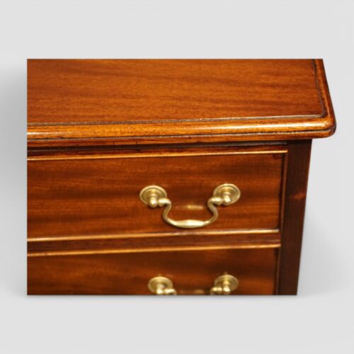Pair of mahogany bedside chests top moulding